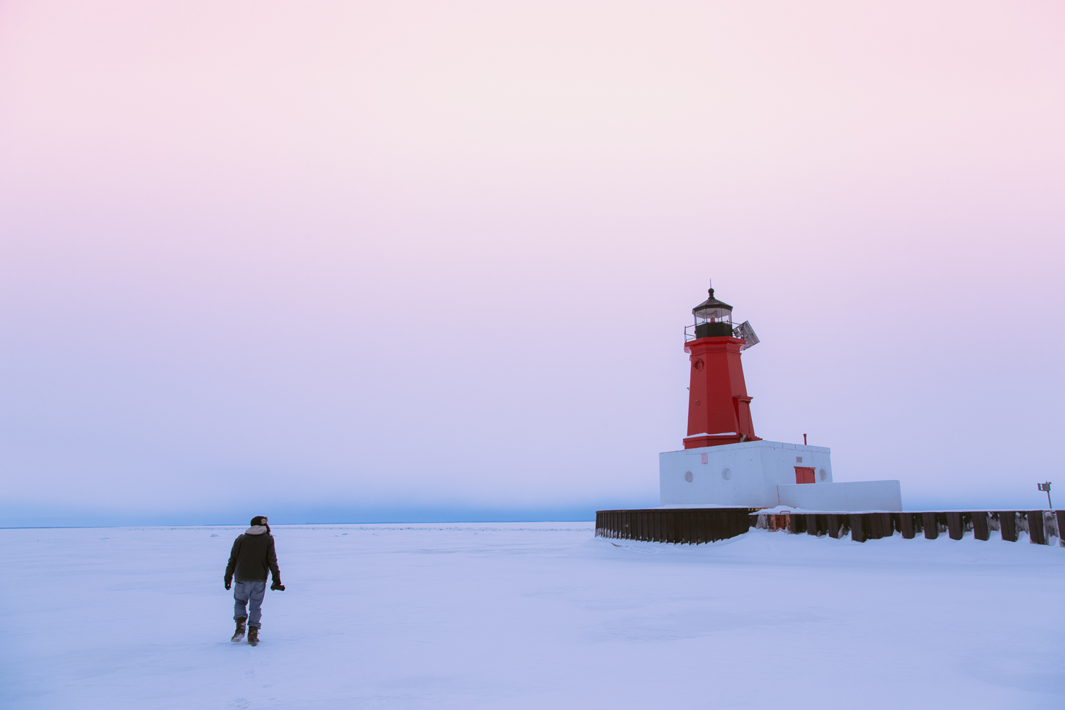 Winter lighthouse on lake michigan